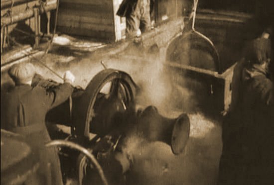 Early 20th century steam windlass in action Image of steam windlass